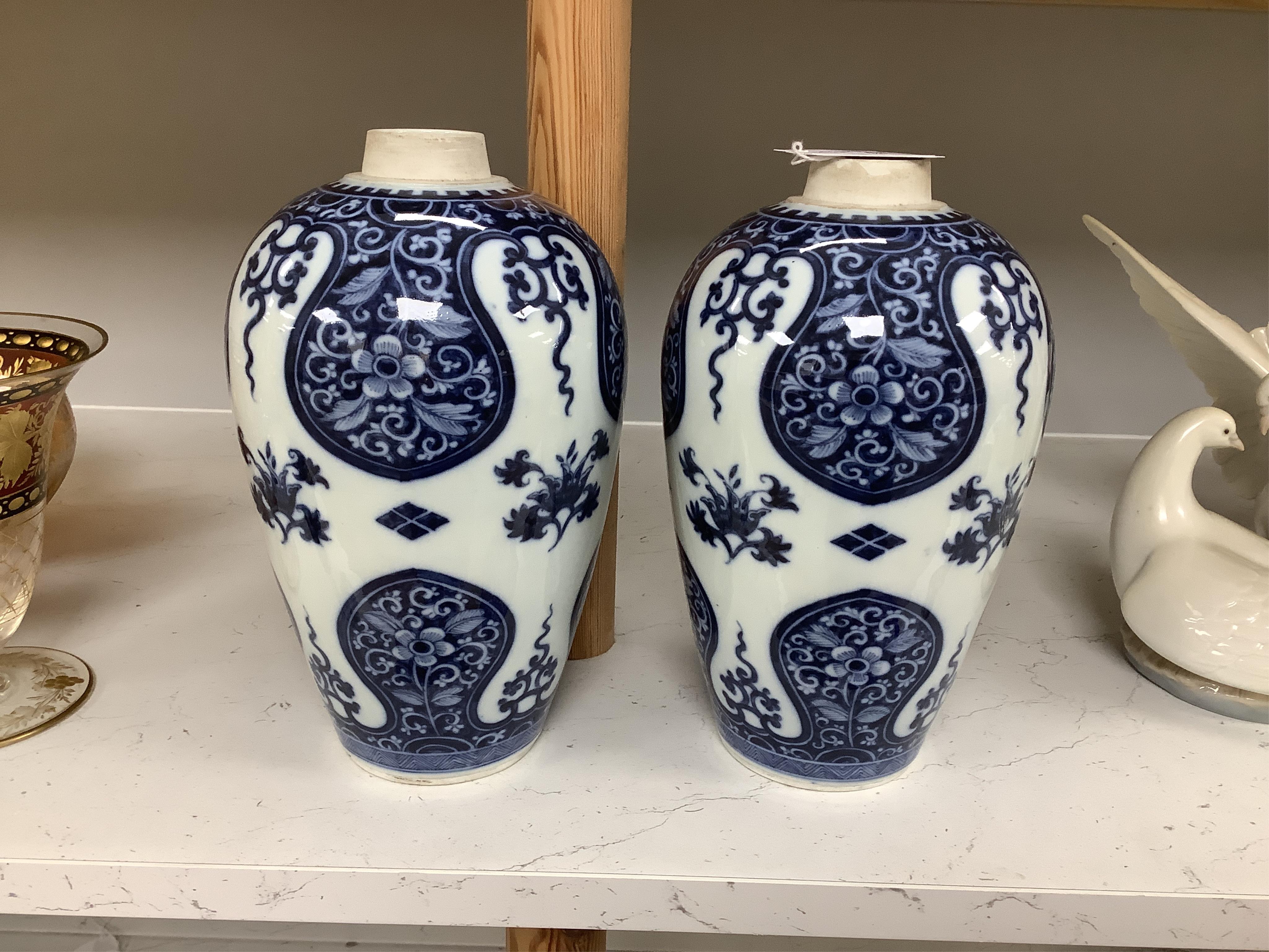 A pair of Samson of Paris blue and white vases, in Kangxi style 23cm high. Condition - good